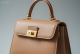Mini Luxe Top-Handle Bag in Soft Clay Beige, gold hardware and leather close-up