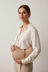 Female model carrying Soft Curve Shoulder Bag in Soft Beige