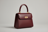 Mini Luxe Top-Handle Bag in Deep Wine Red, side angle view